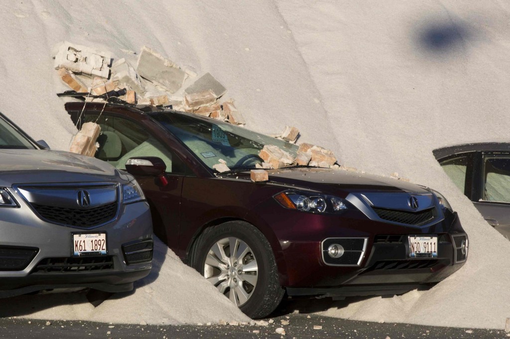 Car damage from building collapse.