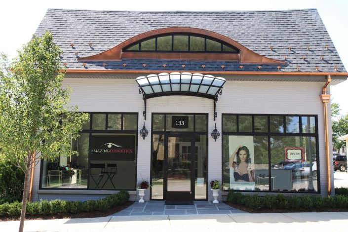 AmazingCosmetics Exterior view of AmazingCosmetics, design features include eyebrow window and glass canopy to match the glamorous image of the brand.