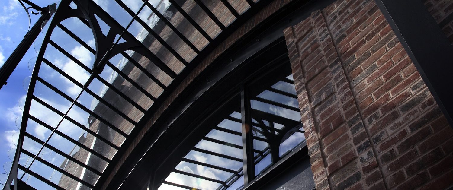 Mickey Finn's art-nouveau iron canopy, and exposed steel framed entrance and windows on the building’s exterior.