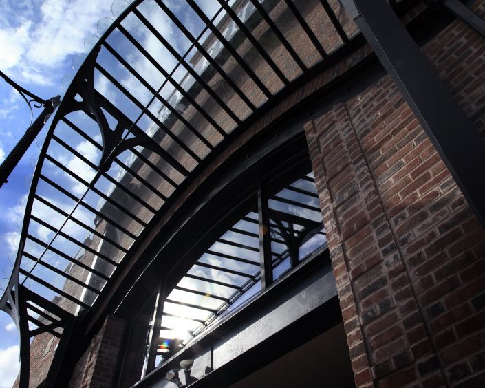 Mickey Finn's art-nouveau iron canopy, and exposed steel framed entrance and windows on the building’s exterior.