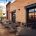 This image is Mickey Finn's outdoor patio, design elements include exposed steel frame and ten-foot garage style overhead doors that open to the dining room.