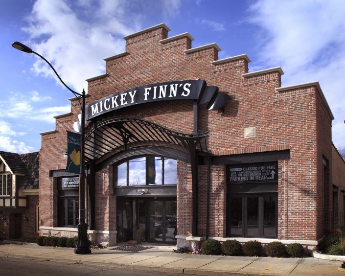 Mickey Finn’s Brewery With a nod to Belgian influence on architecture and brewing, design elements include a stepped gable brick front, art-nouveau iron canopy, and exposed steel framed entrance and windows on the building’s exterior.