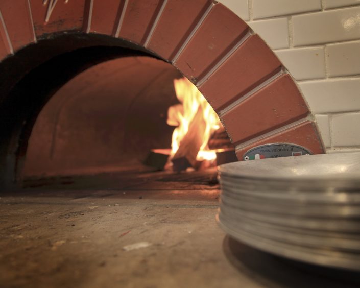 Pizzeria DeVille wood buring pizza oven.