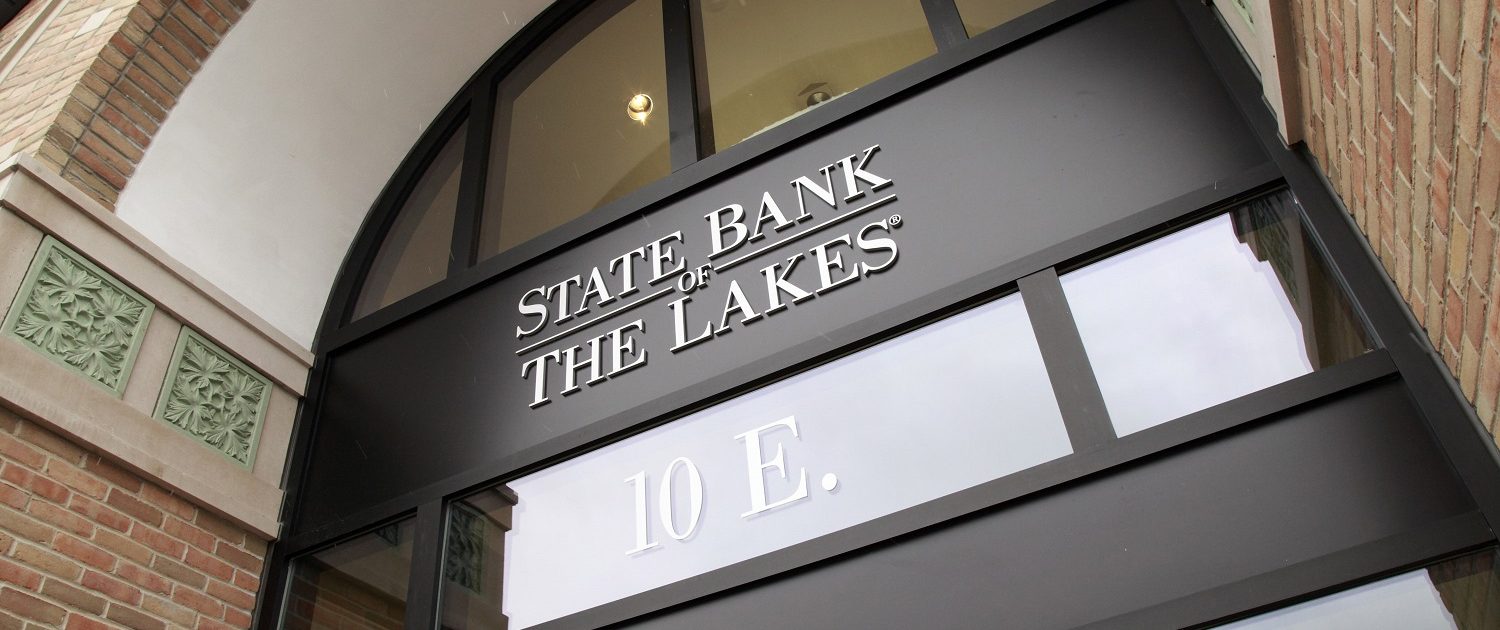 Two-story entrance of State Bank of The Lakes in Round Lake, IL.
