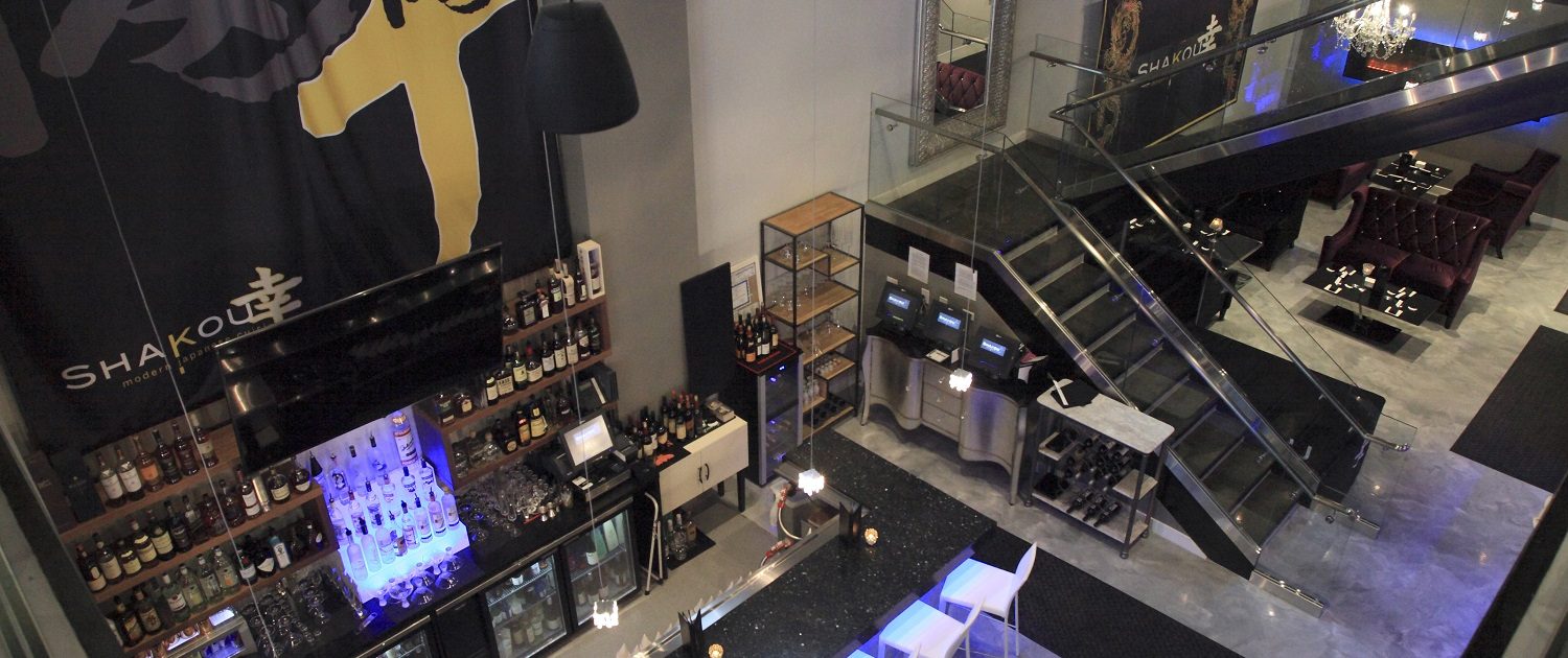 The image is of Shakou St. Charles location from the upper level looking down on the open and spacious bar area..