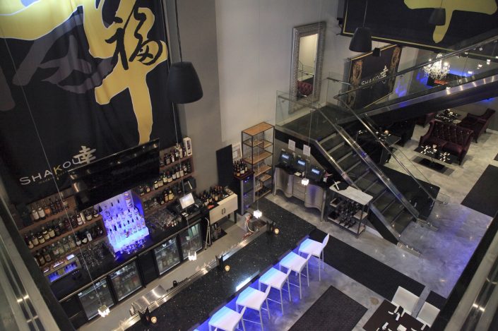 The image is of Shakou St. Charles location from the upper level looking down on the open and spacious bar area..