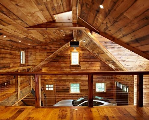 This image shows a dream garage built with hard wood interior and mezzanine.