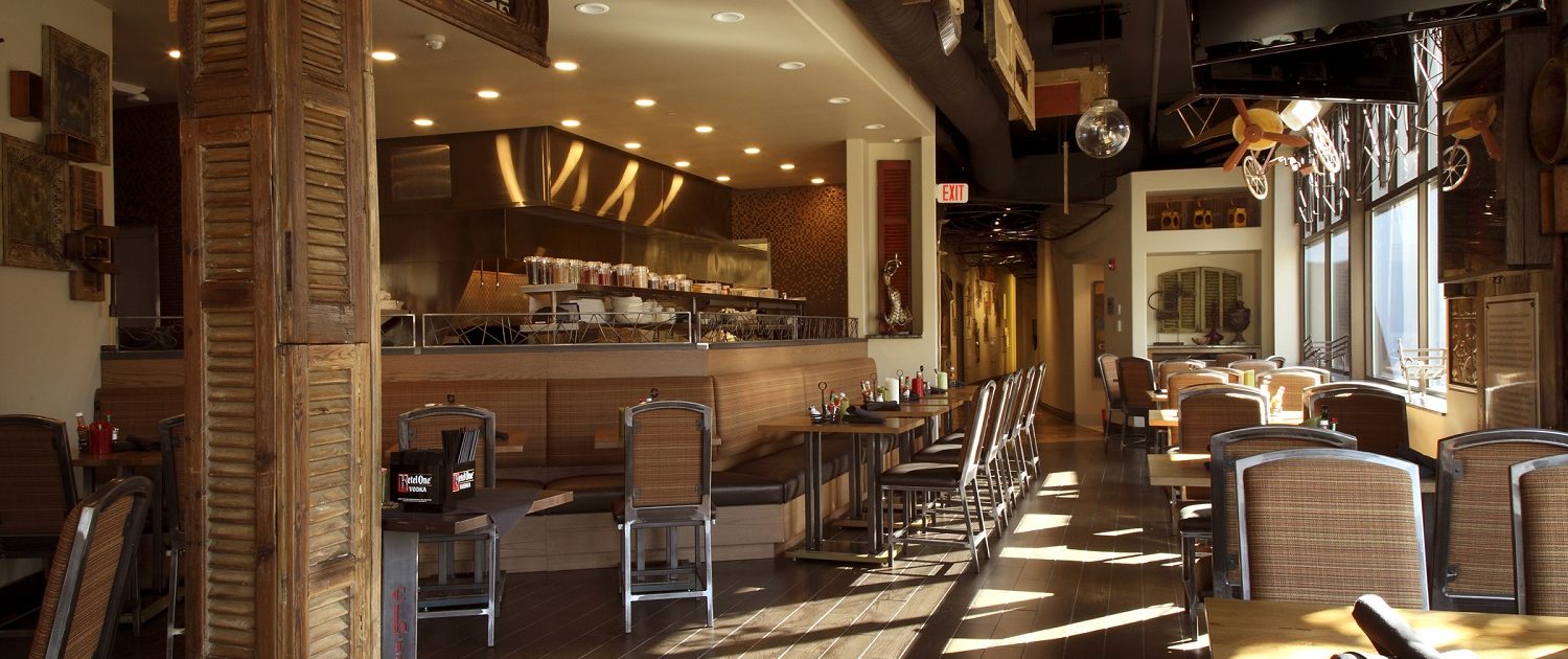 View of the open kitchen and dining area at Chili U.