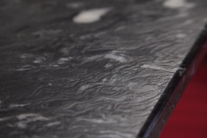 Muller Trading Company Inc Muller Trading Company conference room table made out of black marble.