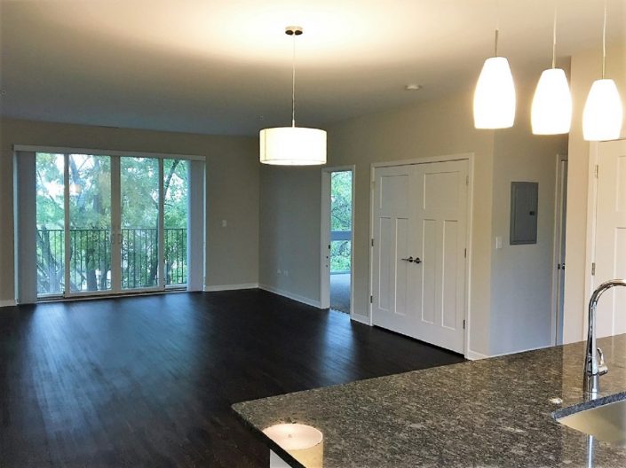 Northline Apartments in Libertyville, IL. View of the main living space and balcony.