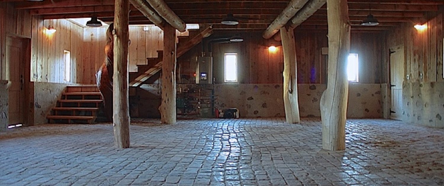 Private Artist Studio Private Artist Studio lower level granite cobbles pave the 3-car garage floor.