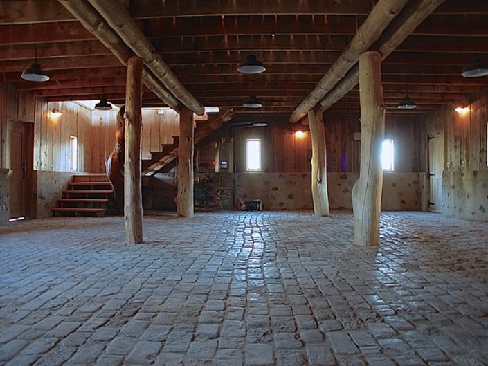 Private Artist Studio Private Artist Studio lower level granite cobbles pave the 3-car garage floor.