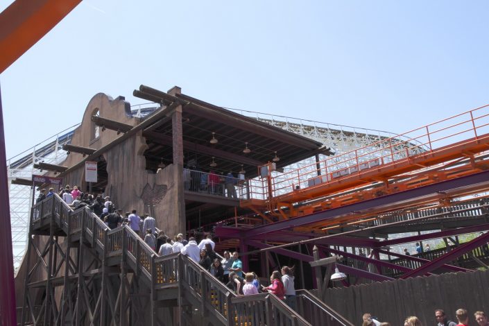 Six Flags Great America - Raging Bull designed to look like a ruined southwestern mission with a structure of tall log poles and a platform of steel and concrete.